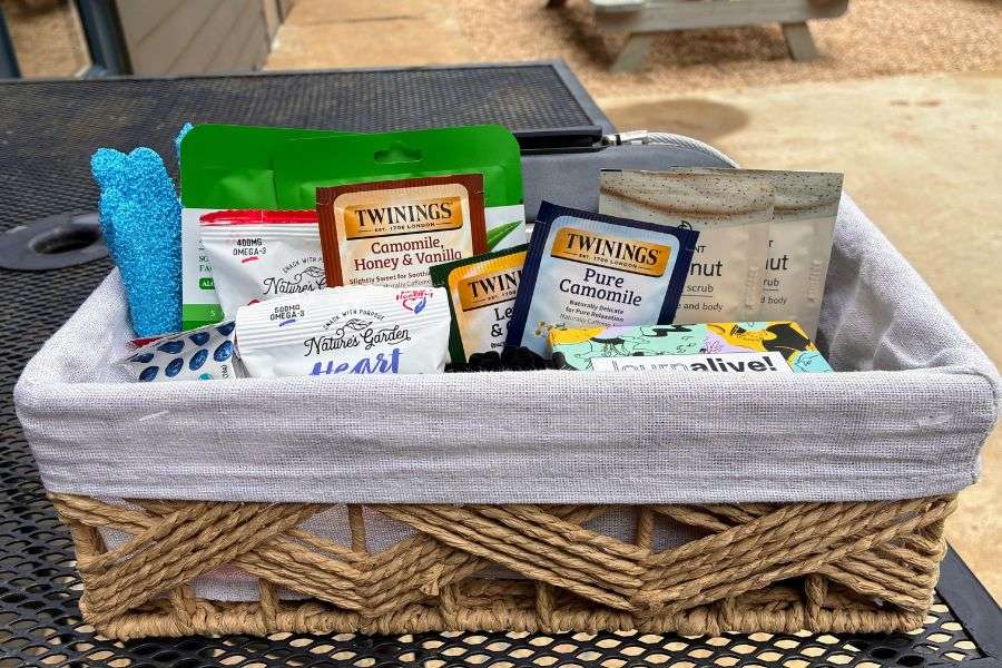 Off the Grid on the Ridge digital detox package basket at Love Ridge Mountain Lodging with herbal teas, exfoliating scrub, face mask, and wellness items.